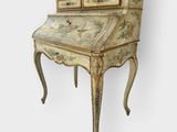 an old writing desk with a drawer on top of it