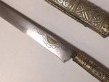 a knife that is laying on a table