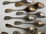 a lot of spoons that are sitting on a table