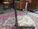 a chair that is sitting on a rug in a room