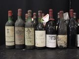 several bottles of wine are lined up in a row on a table