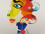 a close up of a glass sculpture of a woman ' s face