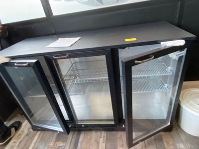 two glass doors that are open in a room