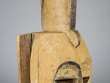 an image of a wooden sculpture of a man ' s face