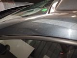a close up of a car with a sticker on it ' s windshield