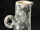 a black and white picture of a vase on a table