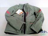 a jacket with a tag on it sitting on a table