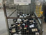 a metal cart with many bottles of wine in it