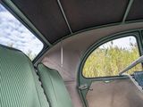 a view of the inside of a car from the driver ' s seat