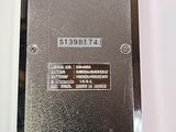 a picture of a metal plaque on a white wall