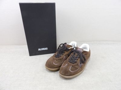 an image of a pair of brown sneakers with a box in the background
