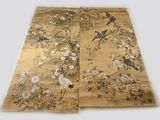 two pieces of cloth with birds and flowers on them