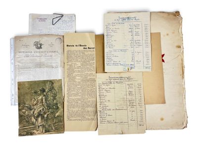 several old papers are stacked on top of each other on a white surface