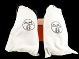 pair of white socks with black logos on them on a black background