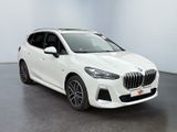 a white bmw x2 parked in a white room
