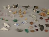 a lot of small figurines that are on the table