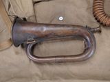 an old trumpet that is laying on a piece of cloth
