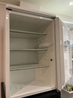 an open refrigerator that is sitting in a kitchen