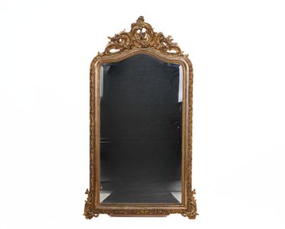 an ornate gold framed mirror on a white background