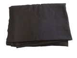 black cloth folded on top of each other on a white background