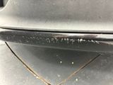 a close up of a car ' s bumper with a rusted bumper