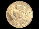 gros plan d'une pièce d'or avec un visage de femme