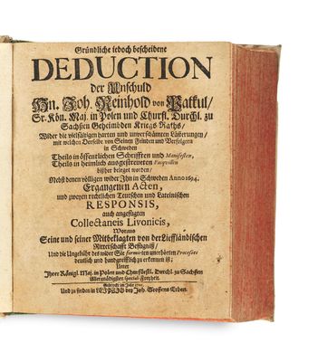 an old book with writing on it sitting on a table