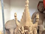 a statue of a castle made out of clay