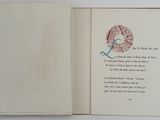 an open book with a picture of a heart on it