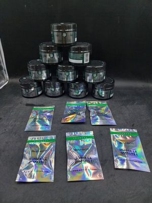 a group of packets of marijuana sitting on top of a table
