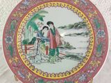 a plate with a picture of two people on it