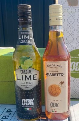 two bottles of alcohol sitting next to each other on a table