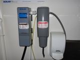 a picture of a wall mounted water heater and a water dispenser