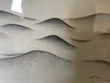 a black and white drawing of a mountain in a glass case