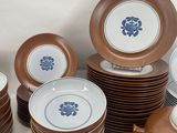 a lot of plates and cups on the table