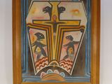 une peinture représentant une croix accrochée au mur d'une pièce