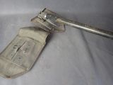 an old metal tool that is laying on a table