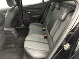 the back seats of a car with a remote control in it