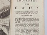 an open book with a picture of a city on it