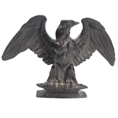 a statue of an eagle that is sitting on a table