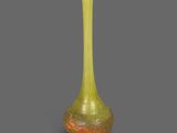 vase en verre jaune et vert sur fond gris