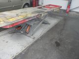 an image of a car being worked on in a garage