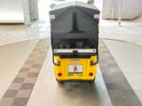 a black and yellow cart that is sitting on the floor