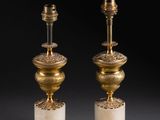 pair of antique brass table lamps with marble bases and a green apple