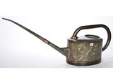 an old metal watering can with a wooden handle on a white background
