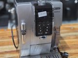 an image of a coffee machine on a wooden table