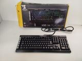 a keyboard and mouse sitting on a table next to a box