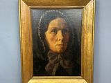 une peinture à l'huile représentant une femme portant un foulard, dans un cadre doré