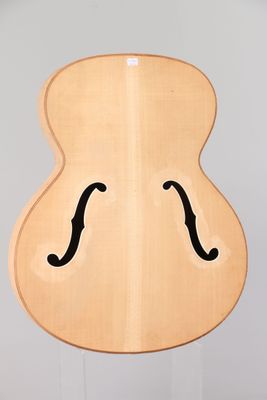 a guitar that is shaped like a face on the back of a guitar