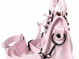 pink leather handbag on white background with strap and handle